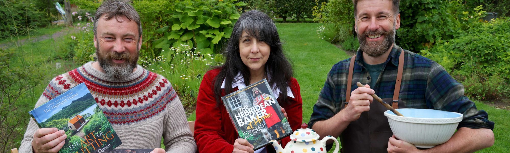 Left to right: Peter MacQueen holding his book "The Art of Hutting", Lee Randall holding the book "The Hebridean Baker at Home", Coinneach MacLeod holding a mixing bowl and spoon.