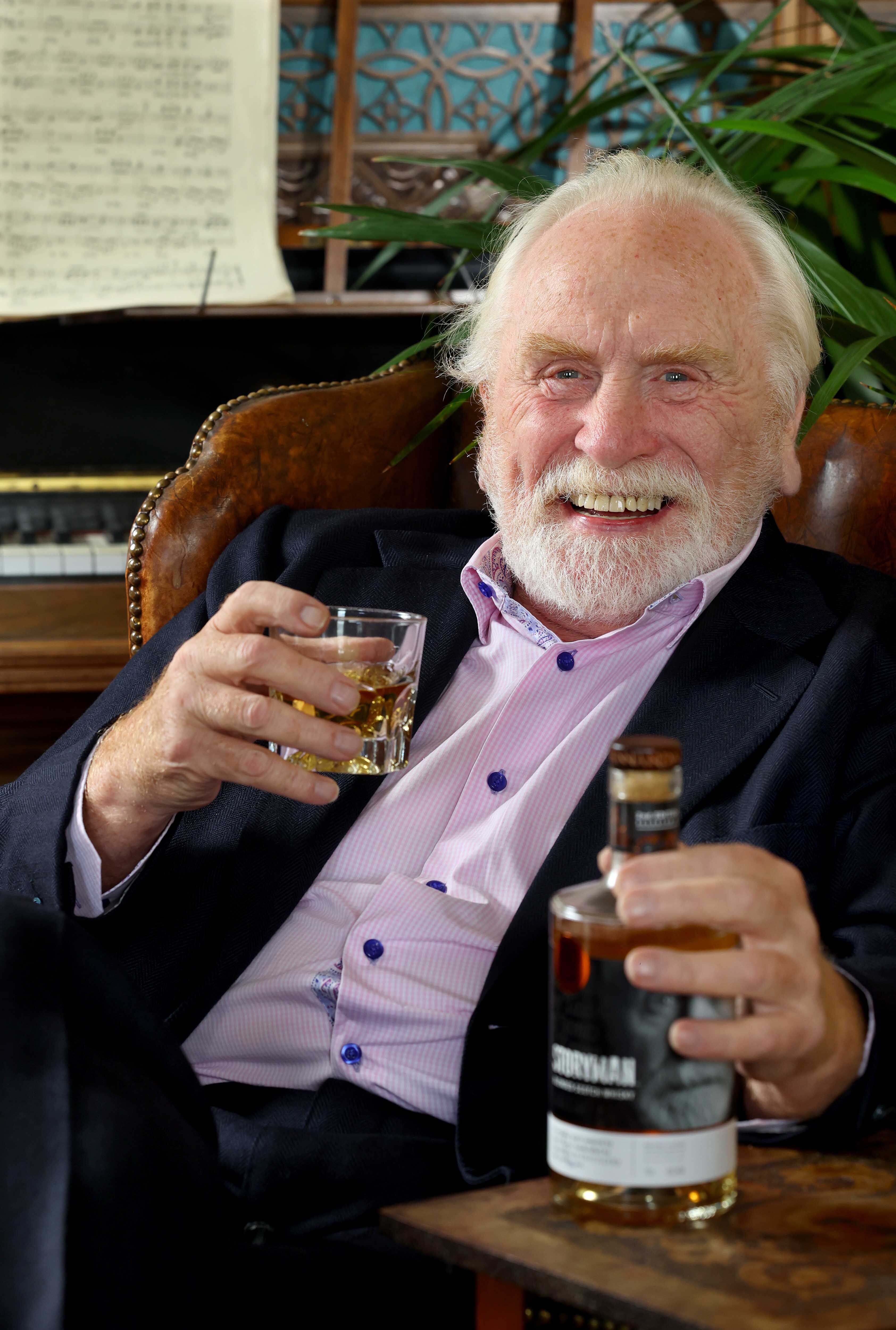 Portrait of James Cosmo with Annandale Distillery Storyman Whisky