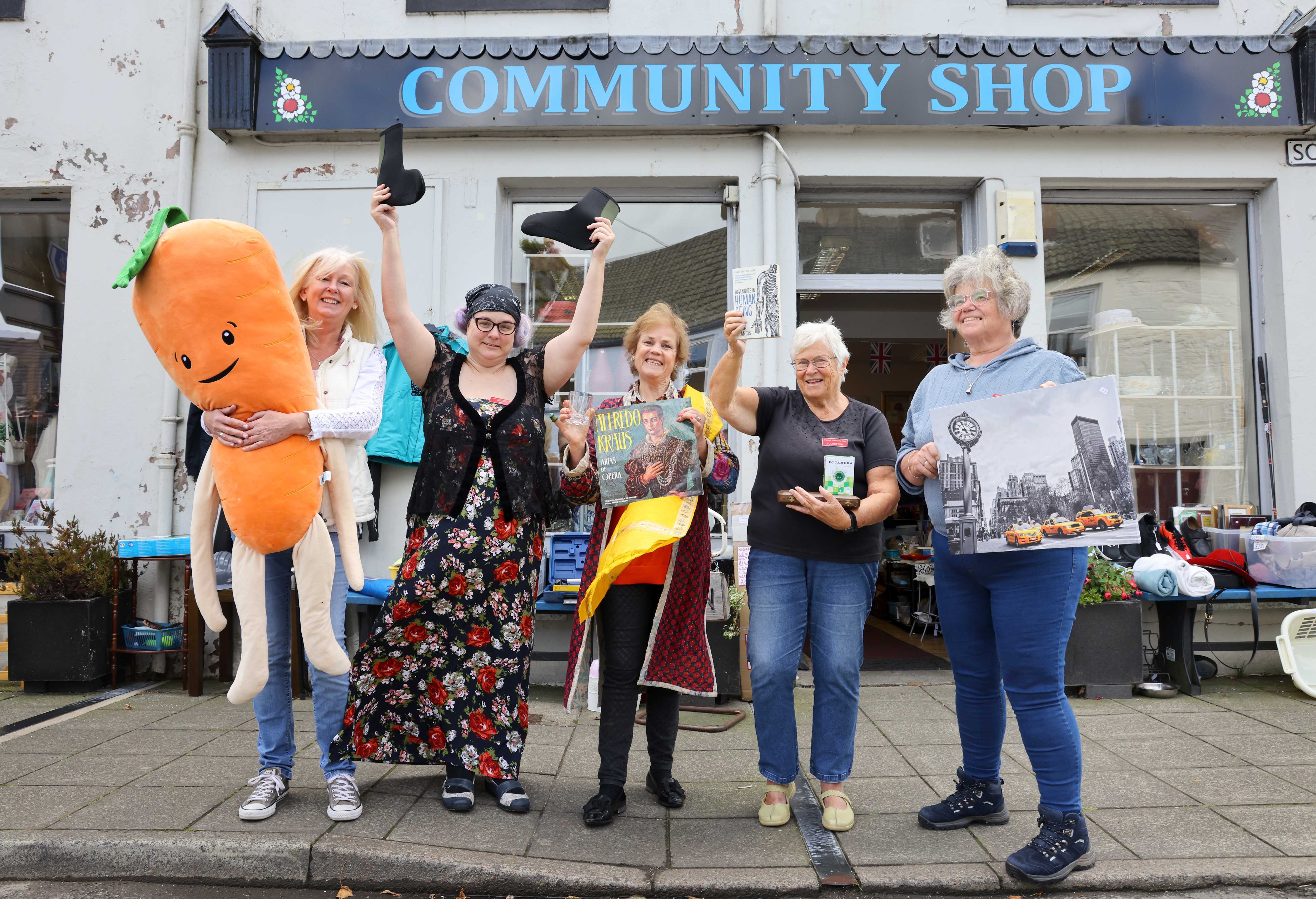 Wigtown Community Shop volunteers and Wigtown Festival Company Chair Cathy Agnew stood outside Wigtown Community Shop.