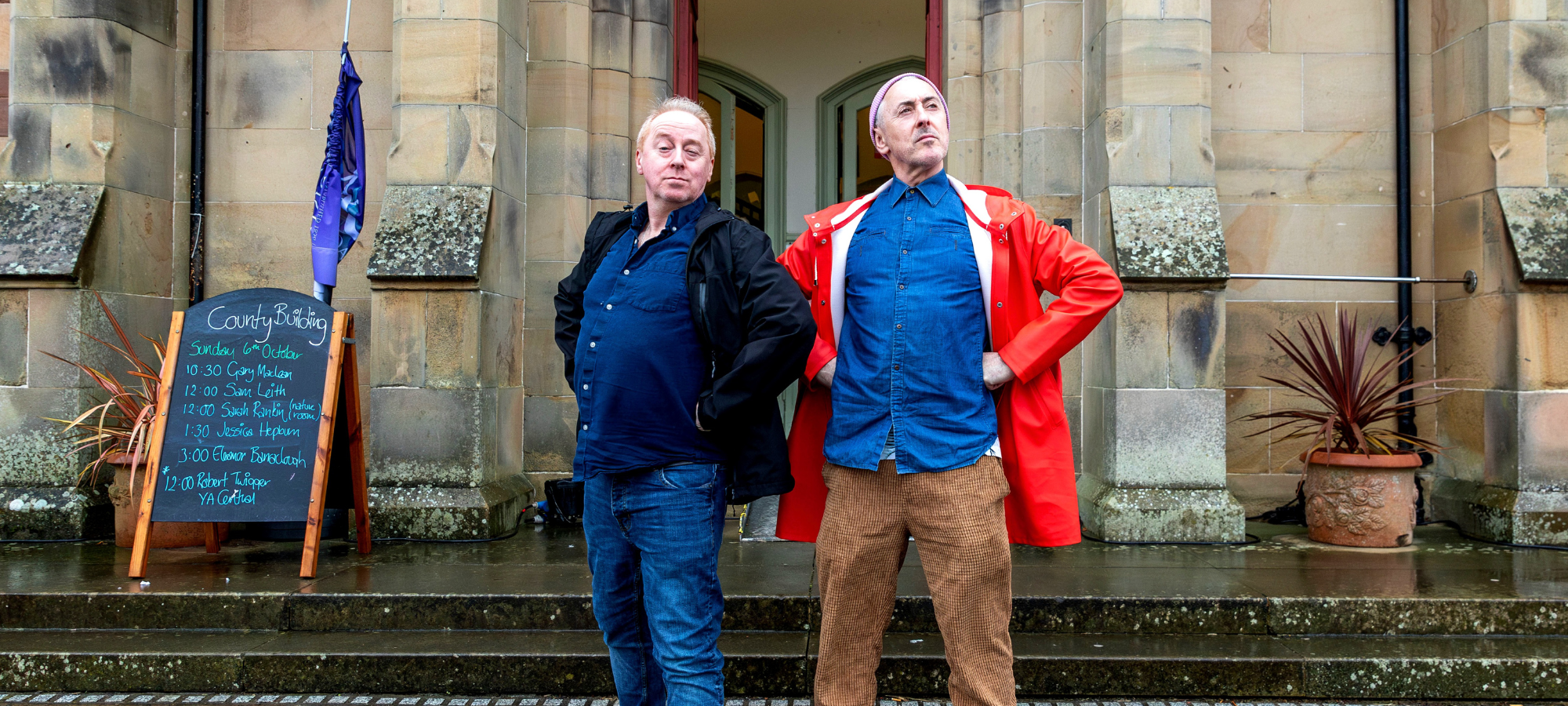 Alan Cumming and Forbes Masson in front of Wigtown County Buildings