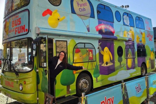 Benji the Bus, a brightly coloured painted double decker bus parked at Big Dog Children's Book Festival in Dumfries.