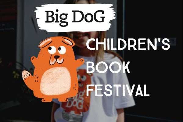 Big Dog Children's Book Festival mascot with a child.