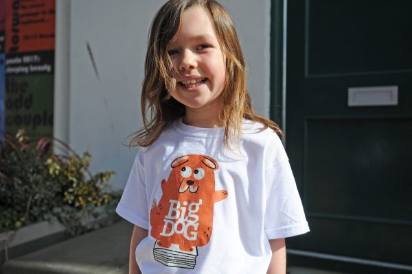 Young person wearing a Big Dog t-shirt at a Children's Book Festival event.