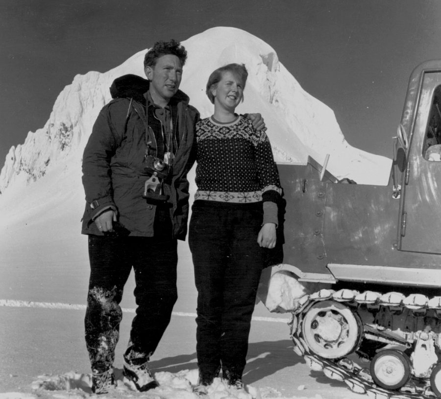 Black and white photo of Andri Snaer Magnason's grandparents in 1956 standing, smiling beside a large snow plough in Iceland.