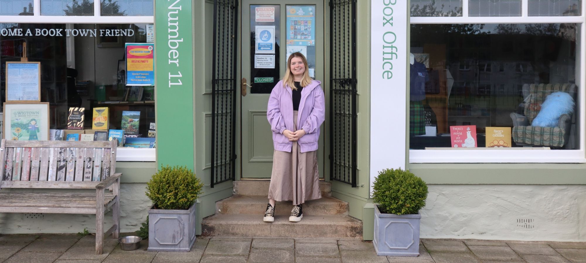 Youth Engagement Officer Morgan Love stood outside Number 11 Bookshop